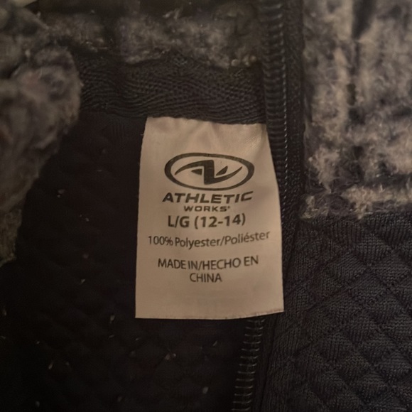 This is a furry navy blue with a little white athletic jacket! - Picture 3 of 3